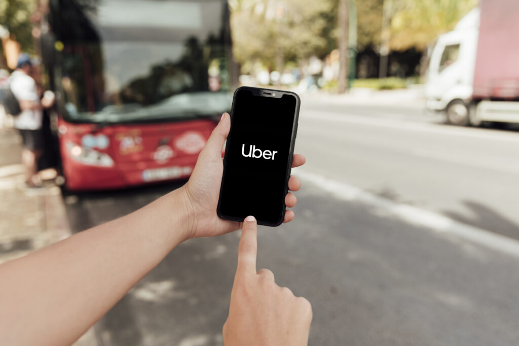 Uber driver app open on a phone, illustrating rideshare driver status during an accident.